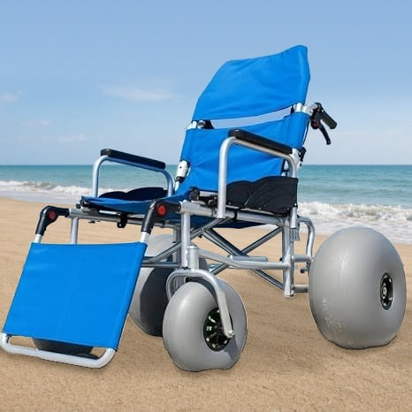 Reclining beach wheelchair on the sand
